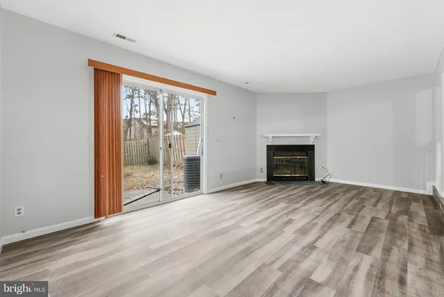 an empty room with fireplace