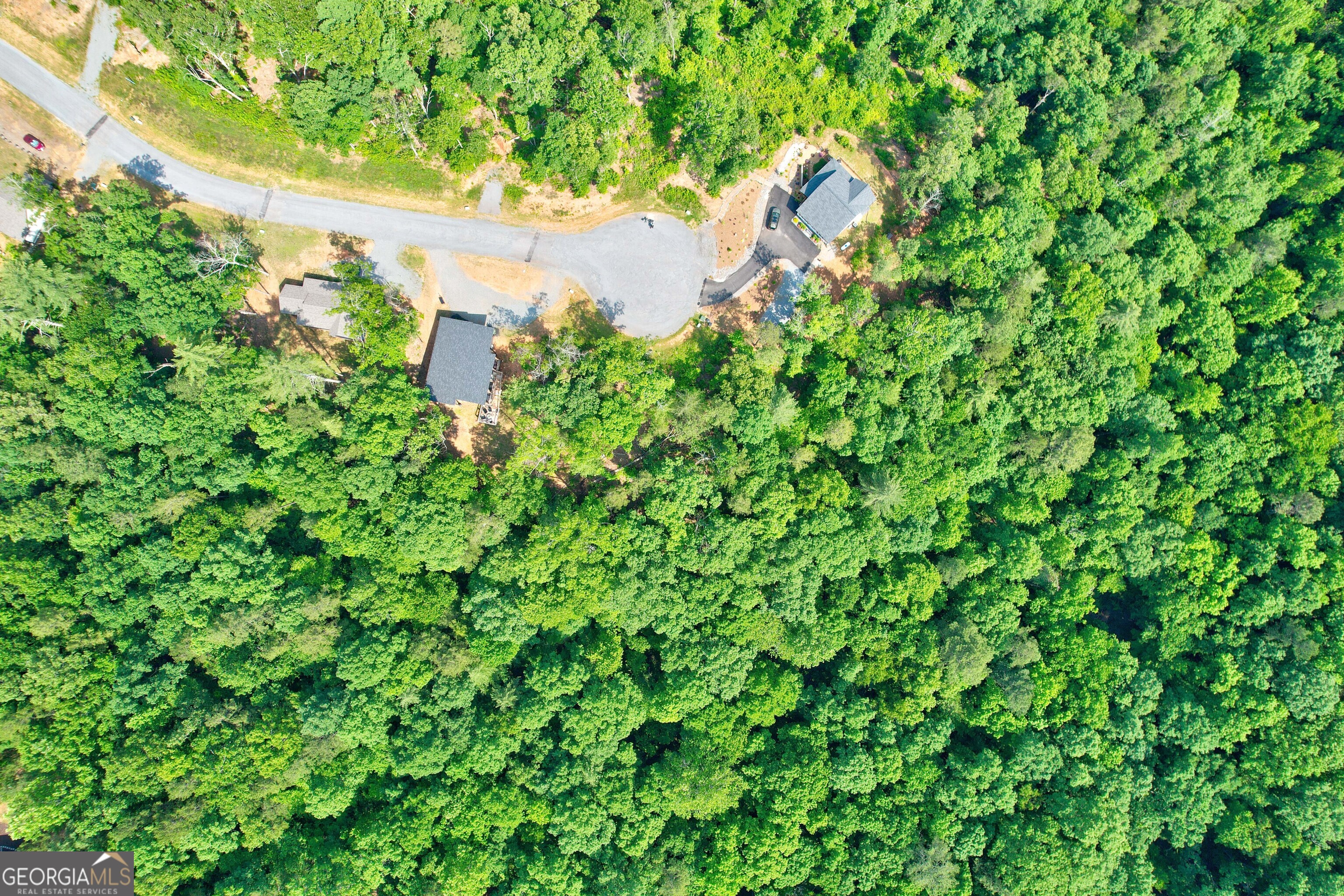 Lot 16 Lake Top Lane Ellijay, GA 30540 - Photo 12 of 17 a backyard of a house with lots of green space and a fountain