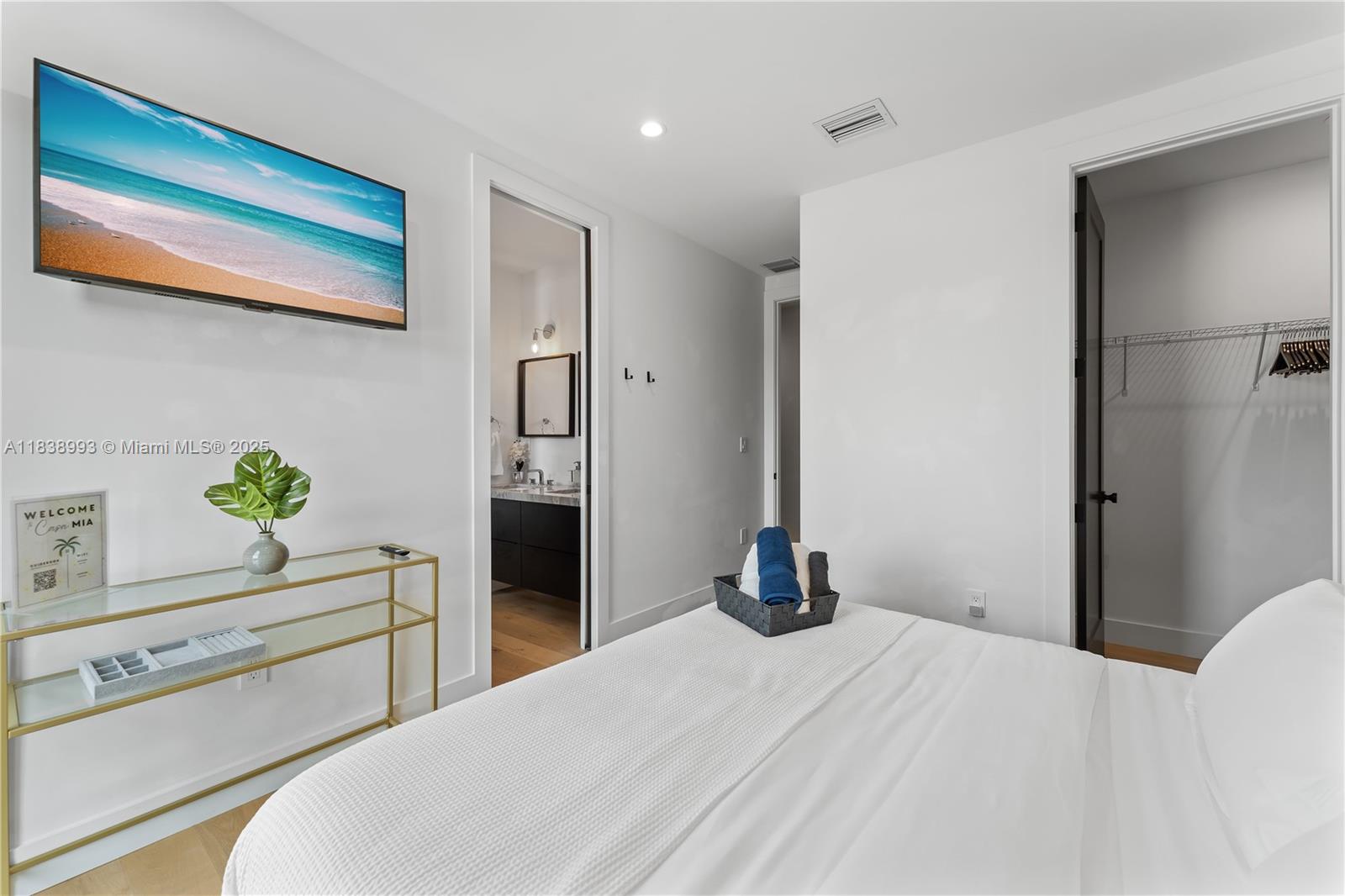 58 Northwest 52nd Street, Unit 58 Miami, FL 33127 - Photo 15 of 21 a bedroom with a bed and hallway