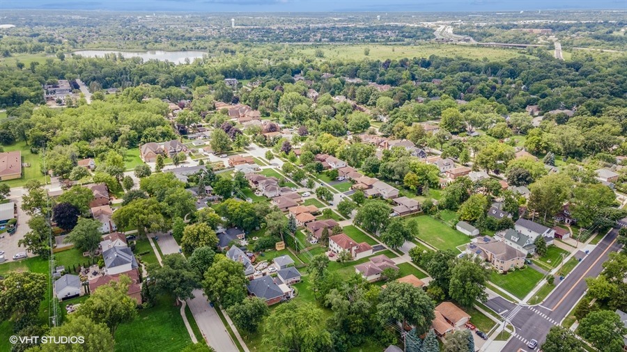 322 South Elm Street Itasca, IL 60143 - Photo 8 of 10 an aerial view of a houses with a lush green hillside