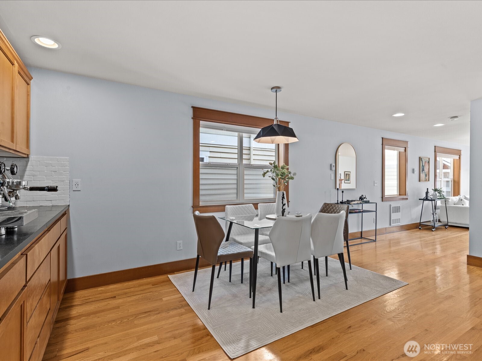 3018 Southwest Hinds Street Seattle, WA 98126 - Photo 14 of 27 a view of a a dining room with furniture window and wooden floor