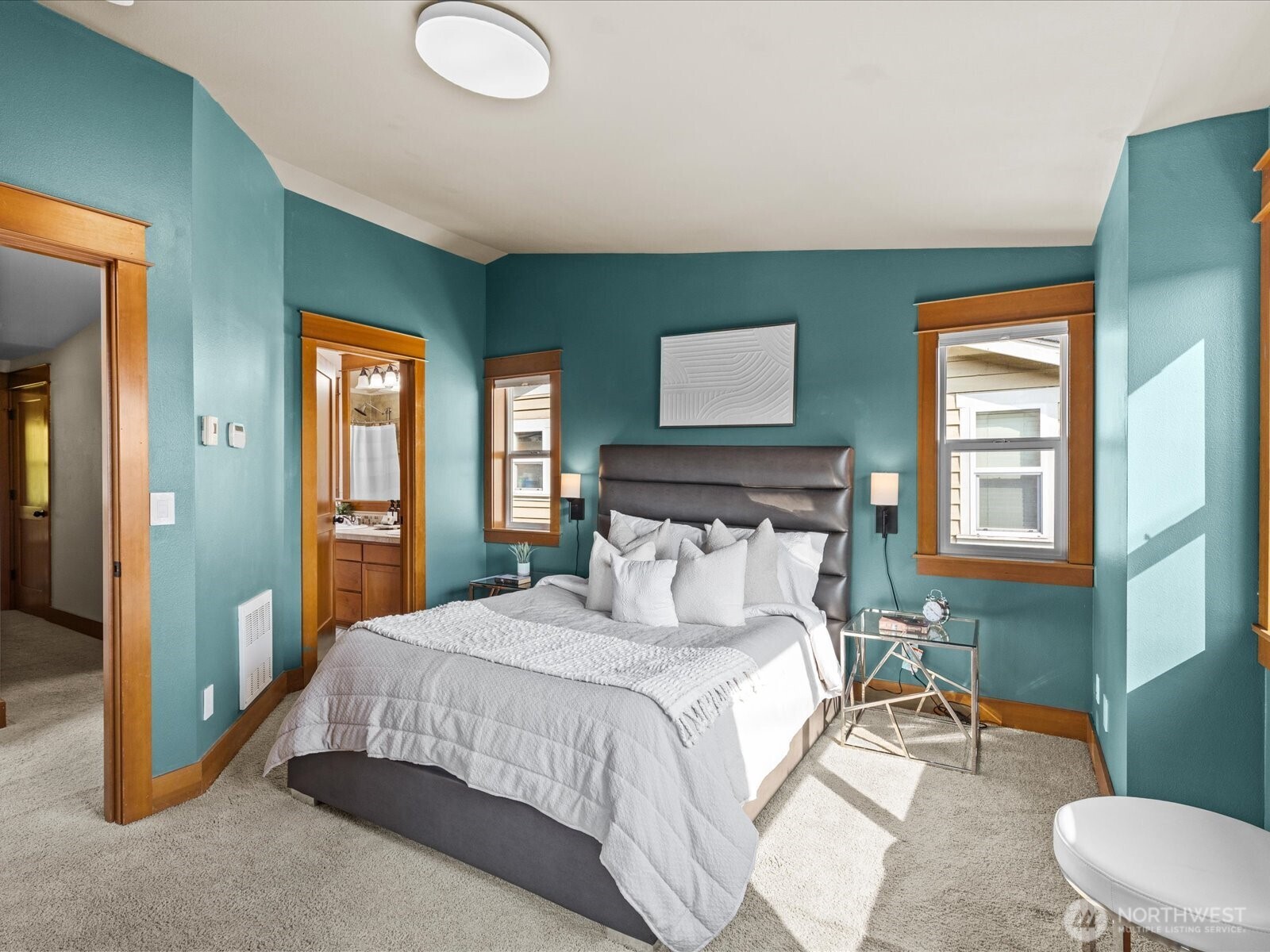 3018 Southwest Hinds Street Seattle, WA 98126 - Photo 16 of 27 a bedroom with a bed and a lamp