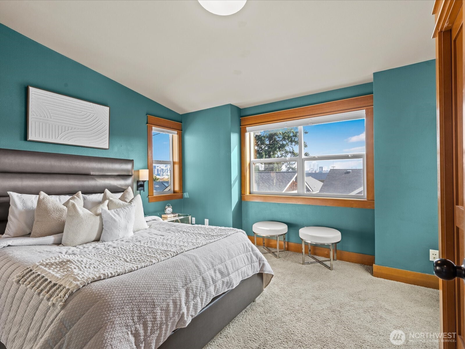 3018 Southwest Hinds Street Seattle, WA 98126 - Photo 19 of 27 a bedroom with a bed and a painting on the wall