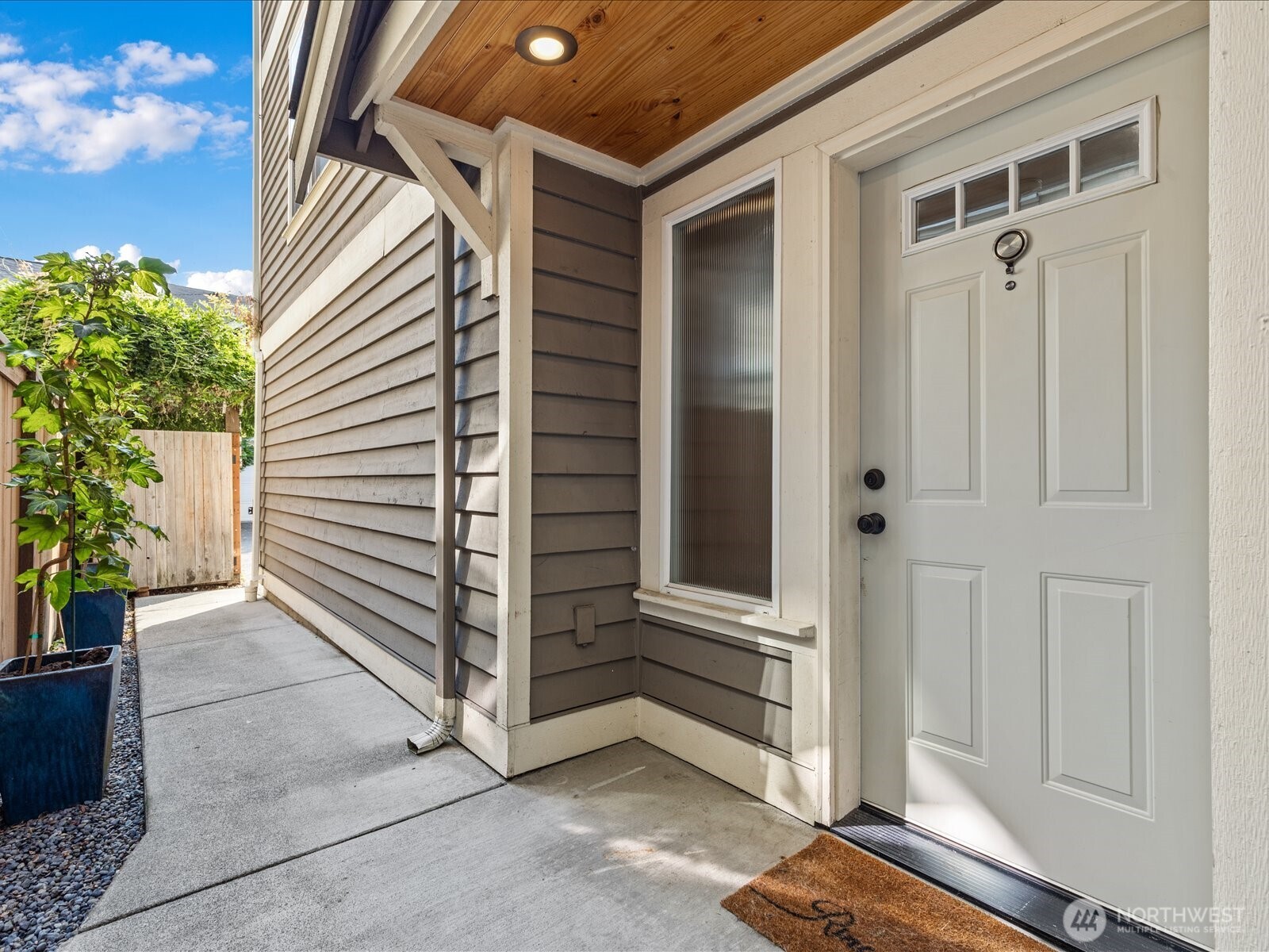 3018 Southwest Hinds Street Seattle, WA 98126 - Photo 2 of 27 a yellow house with a outdoor space