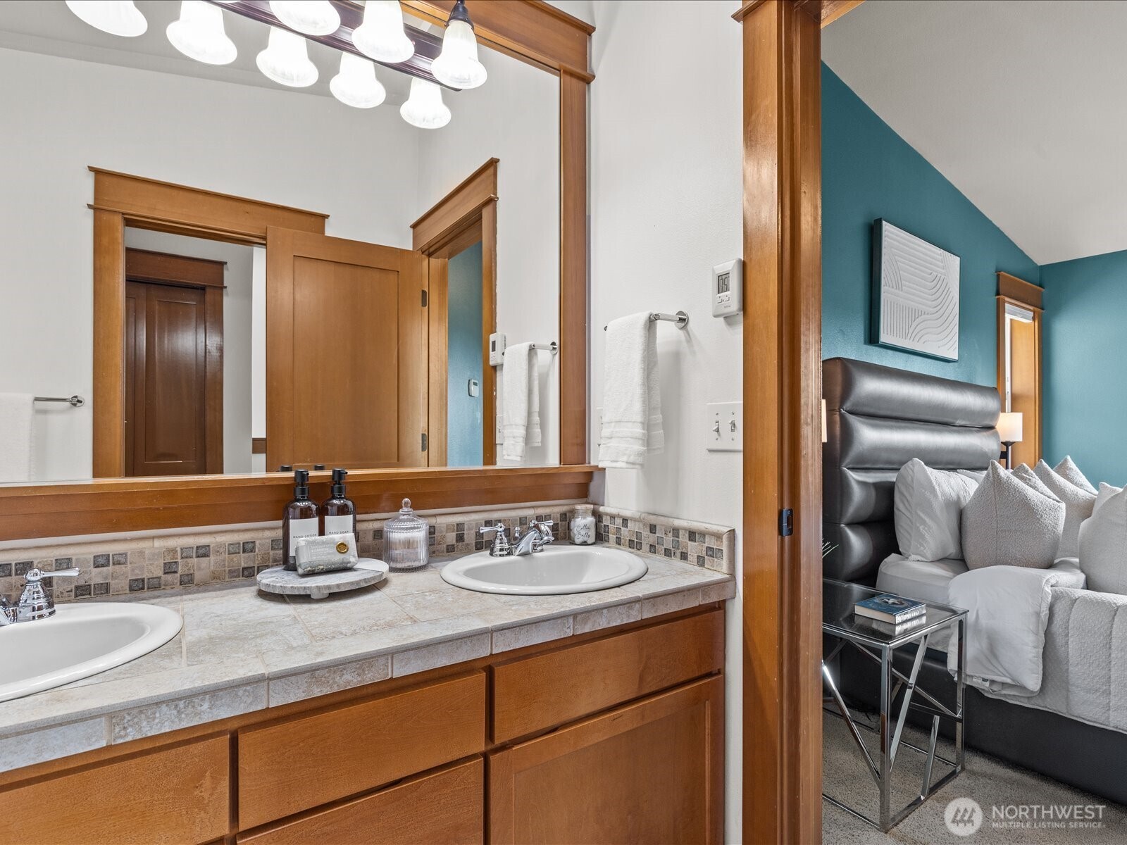 3018 Southwest Hinds Street Seattle, WA 98126 - Photo 21 of 27 a bathroom with a granite countertop sink and a mirror