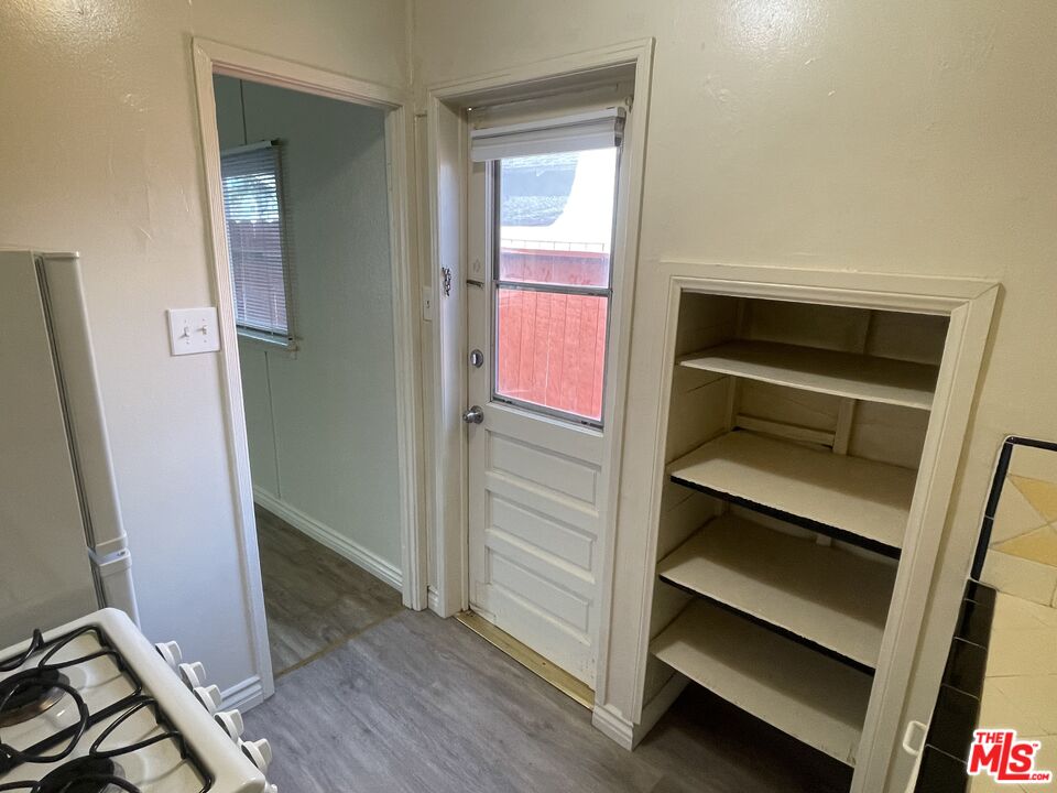 351 Temple Avenue, Unit E Long Beach, CA 90814 - Photo 15 of 22 a view of walk in closet with wooden floor