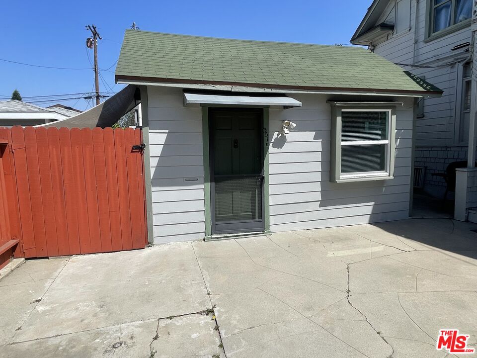 351 Temple Avenue, Unit E Long Beach, CA 90814 - Photo 2 of 22 a front view of a house with a garage