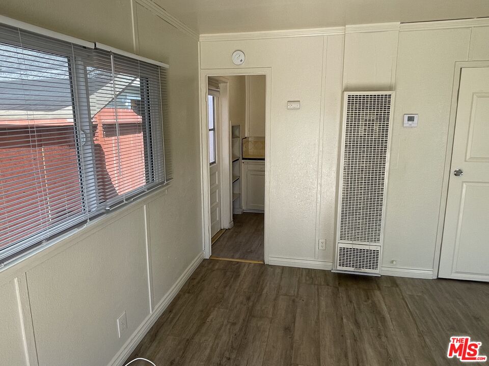 351 Temple Avenue, Unit E Long Beach, CA 90814 - Photo 4 of 22 a view of a hallway with wooden floor and entryway