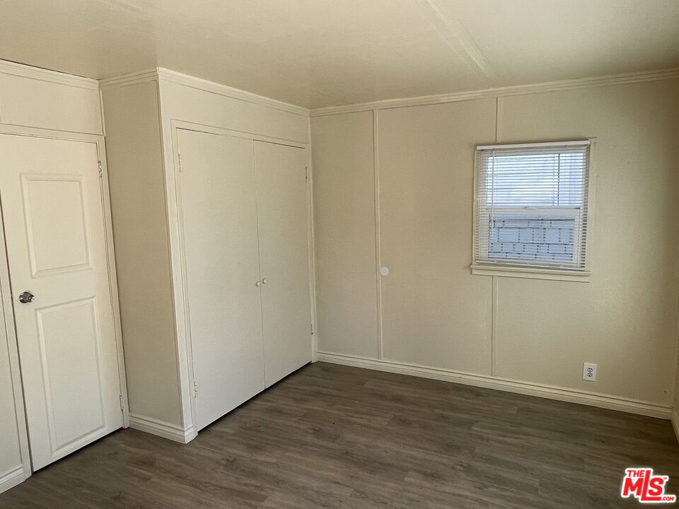 351 Temple Avenue, Unit E Long Beach, CA 90814 - Photo 6 of 22 a view of an empty room with wooden floor