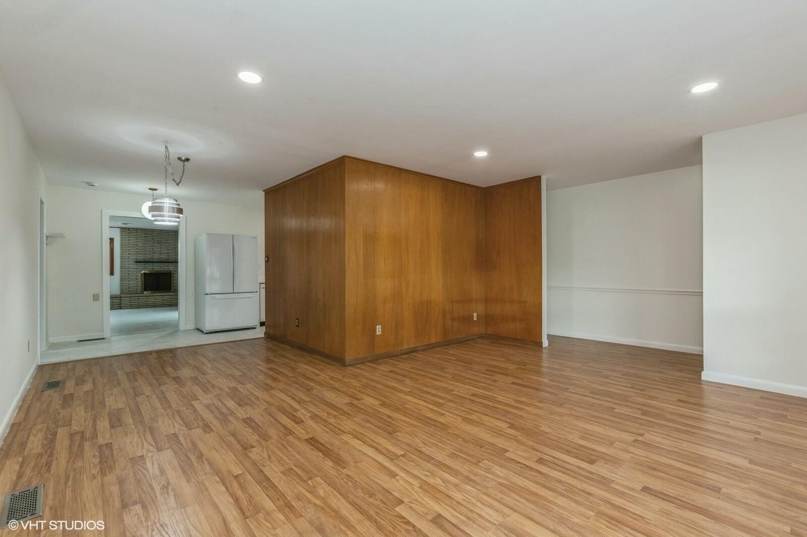 121 Belmont Court Michigan City, IN 46360 - Photo 5 of 12 a view of empty room with wooden floor