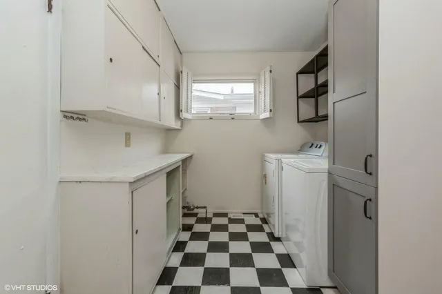 a bathroom with a sink a toilet a window and a mirror