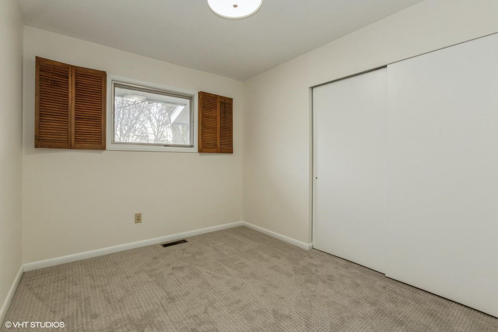 121 Belmont Court Michigan City, IN 46360 - Photo 10 of 12 an empty room with windows
