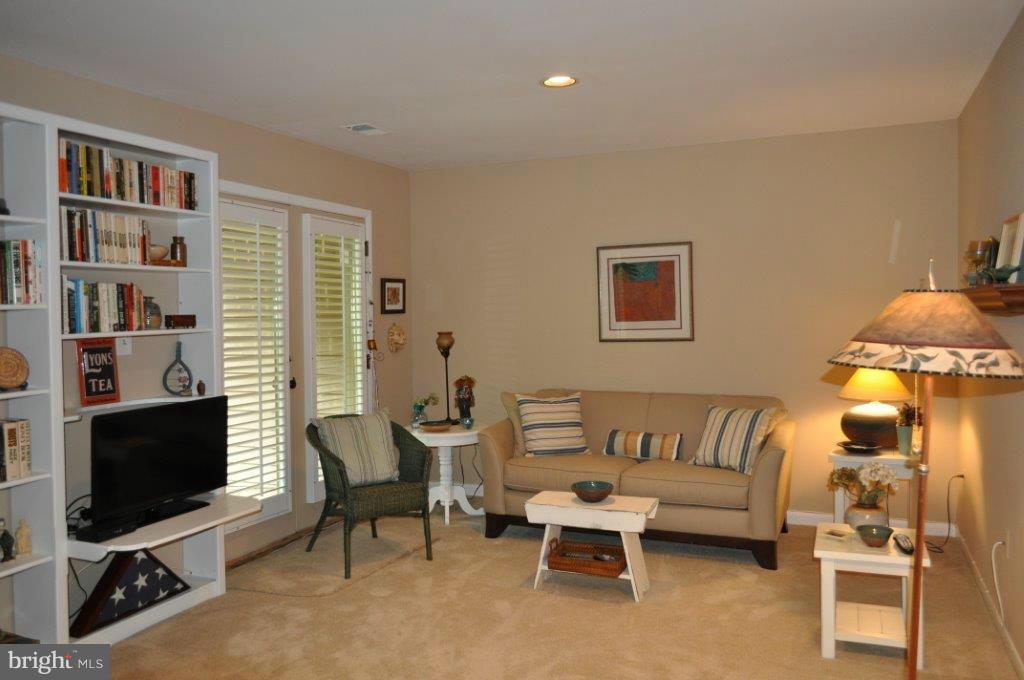 5565 Suffield Court Columbia, MD 21044 - Photo 17 of 30 a living room with furniture and a flat screen tv