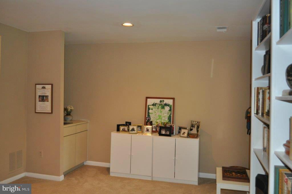 5565 Suffield Court Columbia, MD 21044 - Photo 19 of 30 a room with furniture and wooden floor