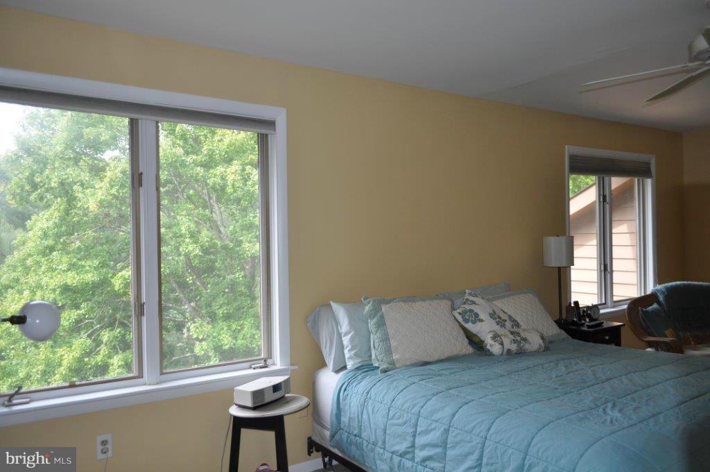 5565 Suffield Court Columbia, MD 21044 - Photo 21 of 30 a bedroom with a bed and a large window