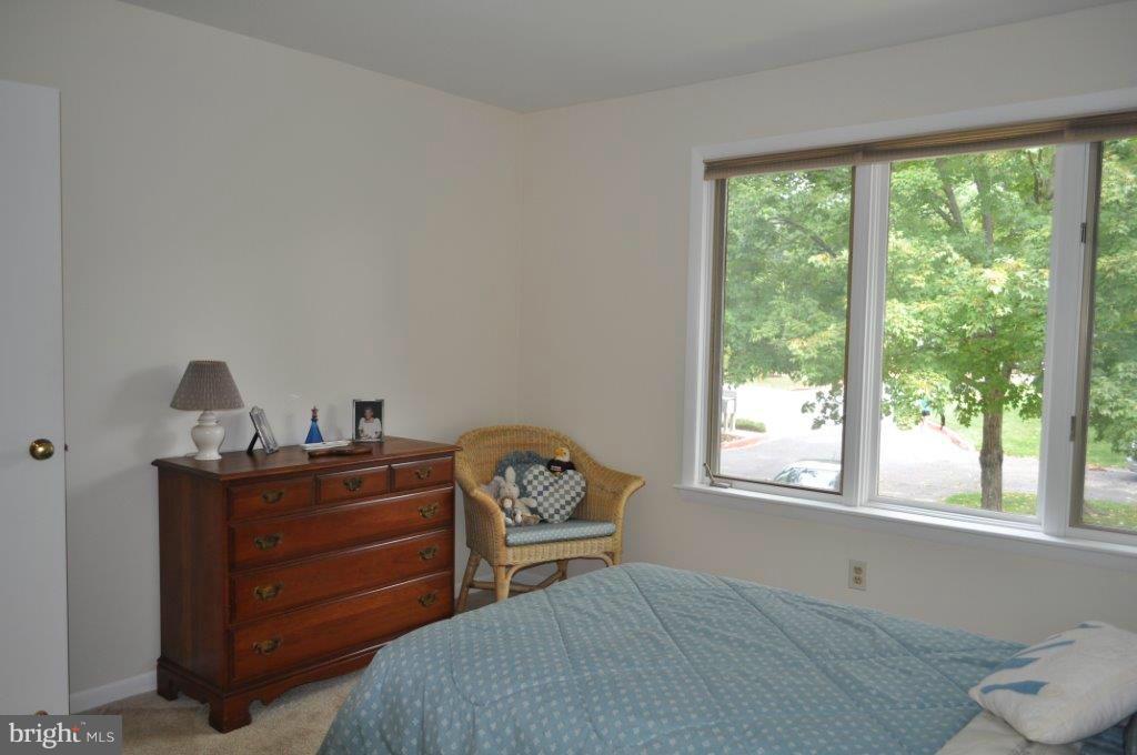 5565 Suffield Court Columbia, MD 21044 - Photo 23 of 30 a bedroom with a bed and a window