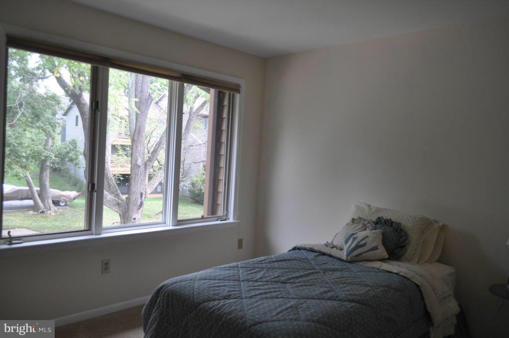 5565 Suffield Court Columbia, MD 21044 - Photo 26 of 30 a bed sitting in a bedroom next to a window