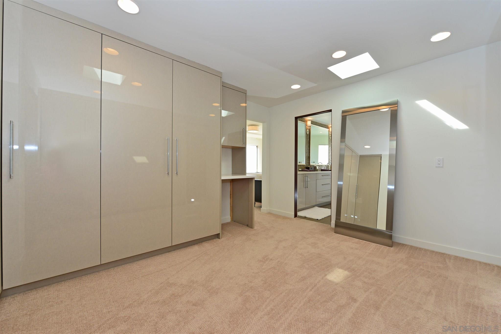 13721 Pine Needles Drive Del Mar, CA 92014 - Photo 21 of 32 an empty room with a bathroom and a mirror