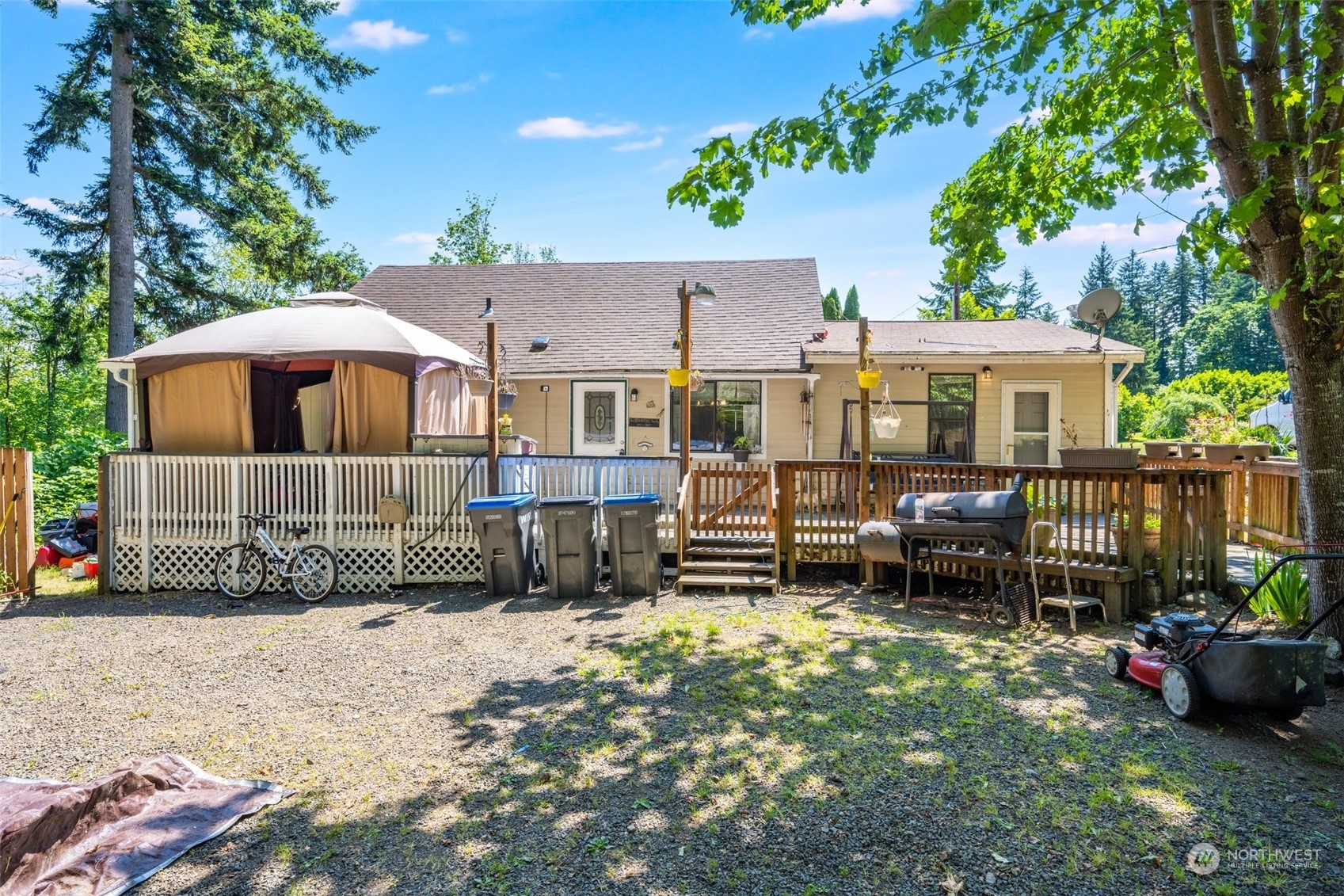 a view of a house with a yard and sitting area