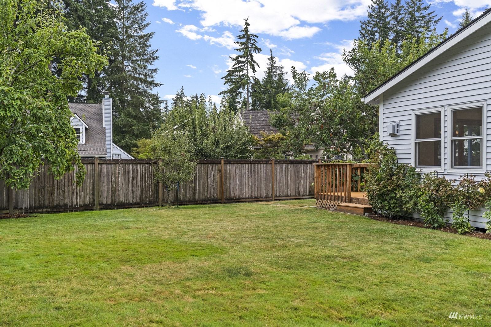 3104 165th Place Southeast Bothell, WA 98012 - Photo 19 of 40 a view of a yard with wooden fence