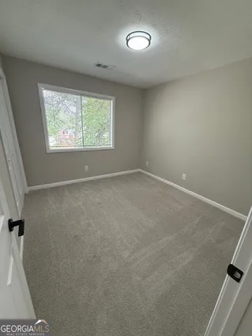 a bathroom with a toilet and a bathtub