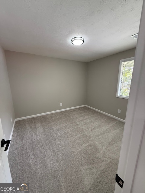 33 Twiggs Corners Peachtree City, GA 30269 - Photo 23 of 32 an empty room with windows