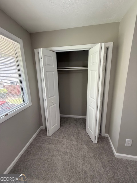 33 Twiggs Corners Peachtree City, GA 30269 - Photo 24 of 32 an empty room with windows and closet