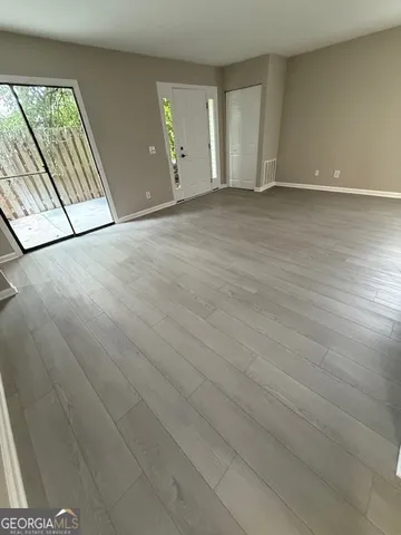 a view of a livingroom with wooden floor