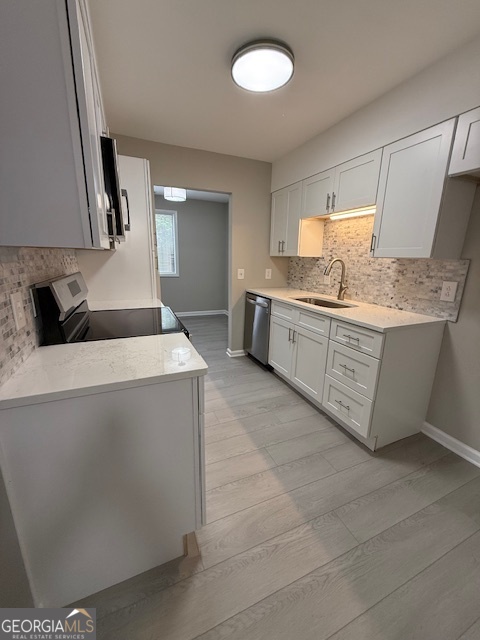 33 Twiggs Corners Peachtree City, GA 30269 - Photo 8 of 32 a kitchen with stainless steel appliances granite countertop a sink and a stove