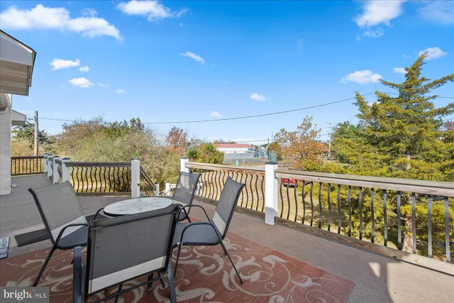 a view of a chairs and table in patio