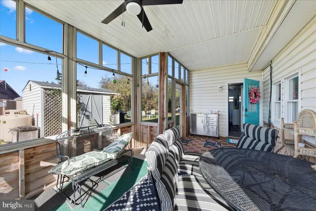 a living room with furniture fireplace and flat screen tv
