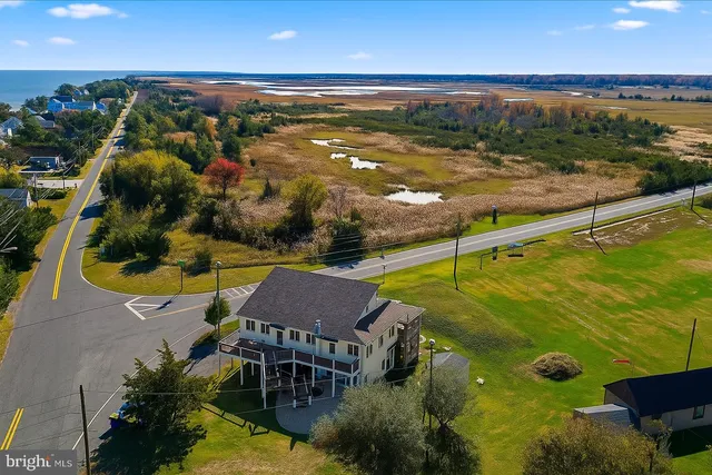a view of a swimming pool with an outdoor seating