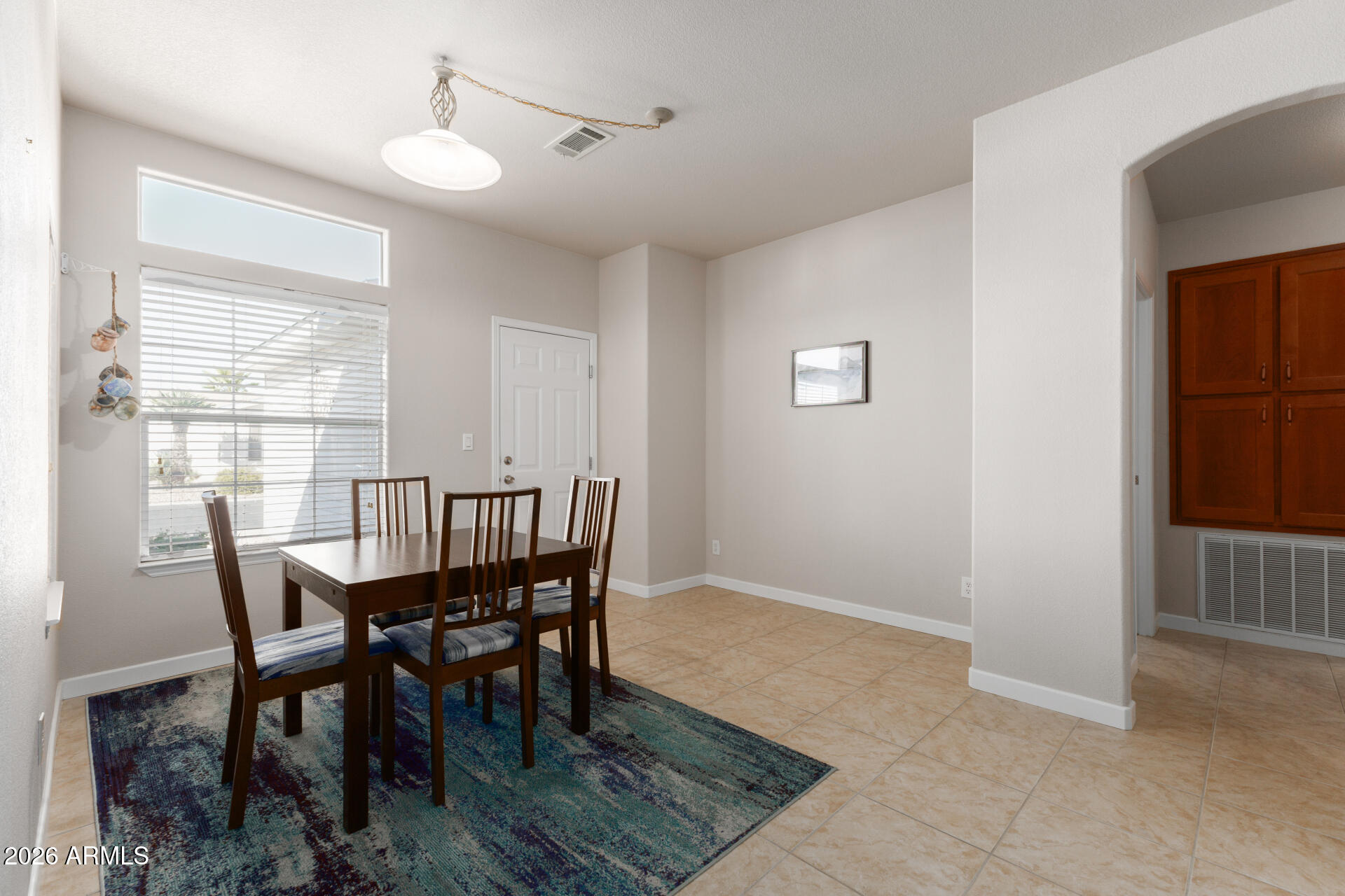 3301 South Goldfield Road, Unit 2056 Apache Junction, AZ 85119 - Photo 12 of 24 Dining/doorway to bedroom 2