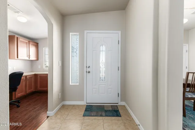 a view of bedroom with a bed and wooden floor