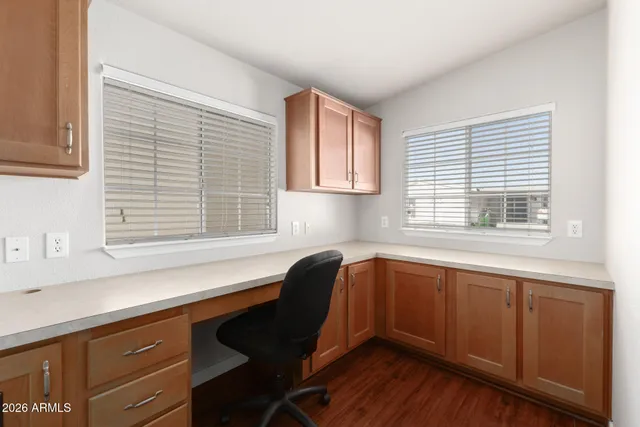 a kitchen with granite countertop a sink cabinets and window