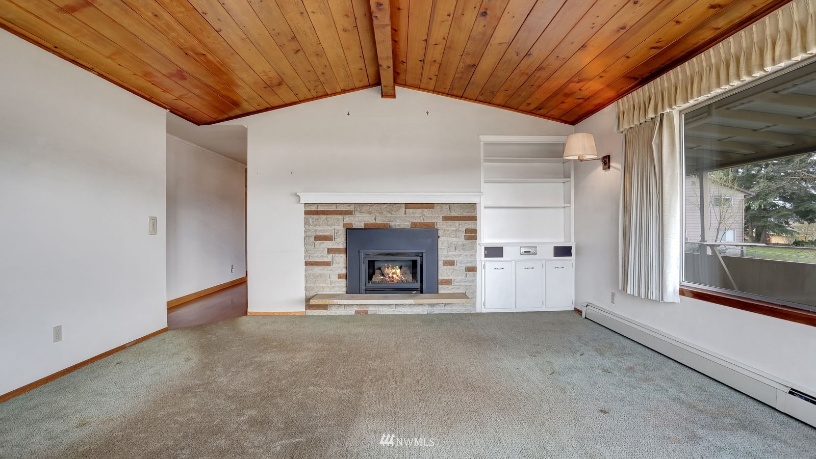 1113 North 38th Street Renton, WA 98056 - Photo 6 of 37 a view of an empty room with a fireplace