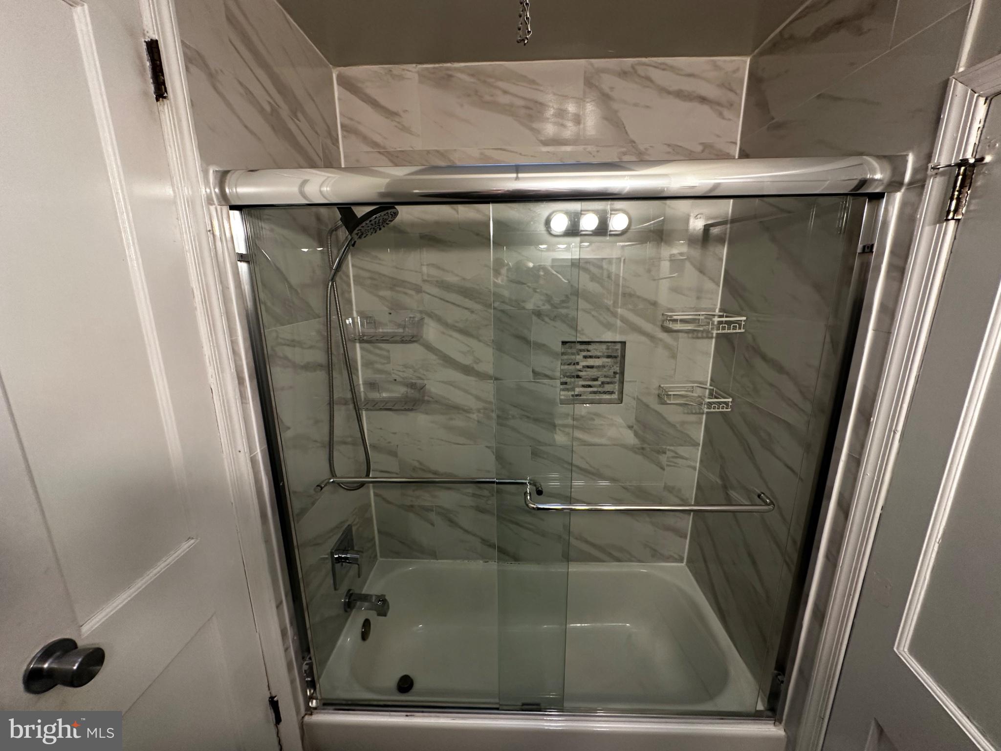 3050 Willits Road Philadelphia, PA 19136 - Photo 8 of 22 Modern glass shower with elegant tiles.