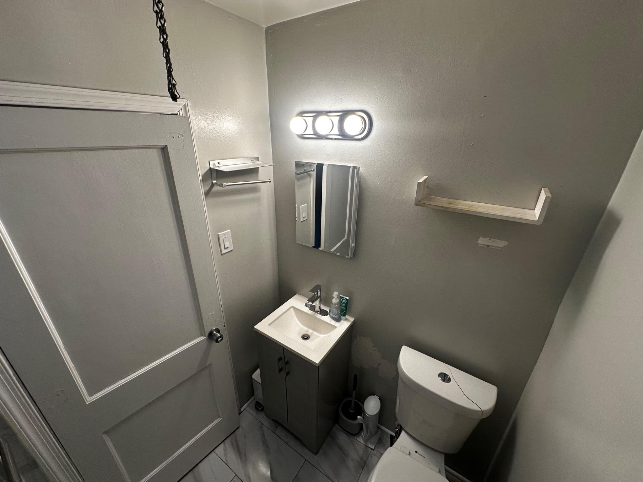 3050 Willits Road Philadelphia, PA 19136 - Photo 10 of 22 a bathroom with a toilet sink and mirror