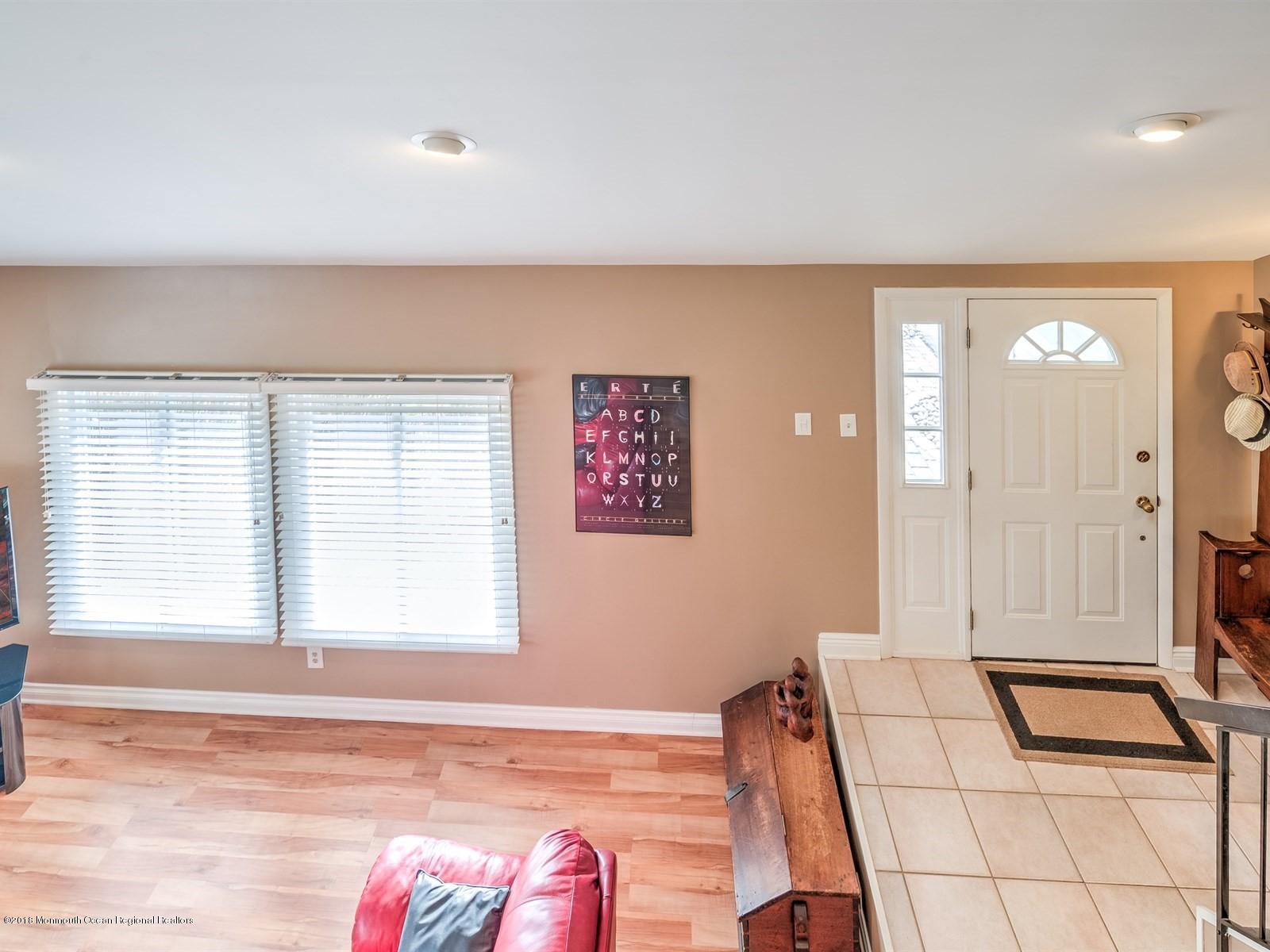 24 Valley Road Manalapan, NJ 07726 - Photo 12 of 30 a bedroom with a bed and a large window
