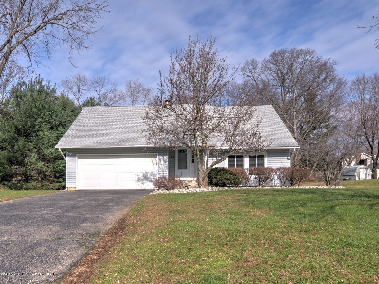 24 Valley Road Manalapan, NJ 07726 - Photo 3 of 30 a front view of house with yard and green space