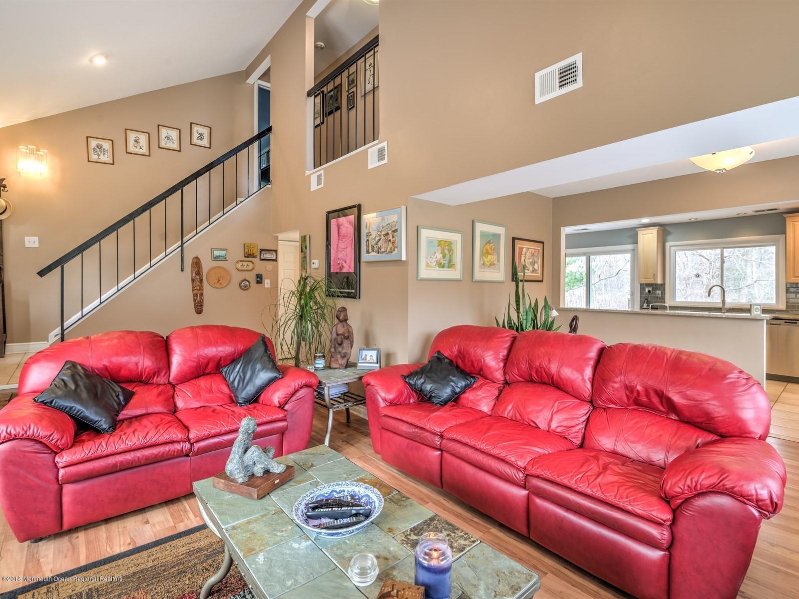 24 Valley Road Manalapan, NJ 07726 - Photo 9 of 30 a living room with furniture and a wooden floor