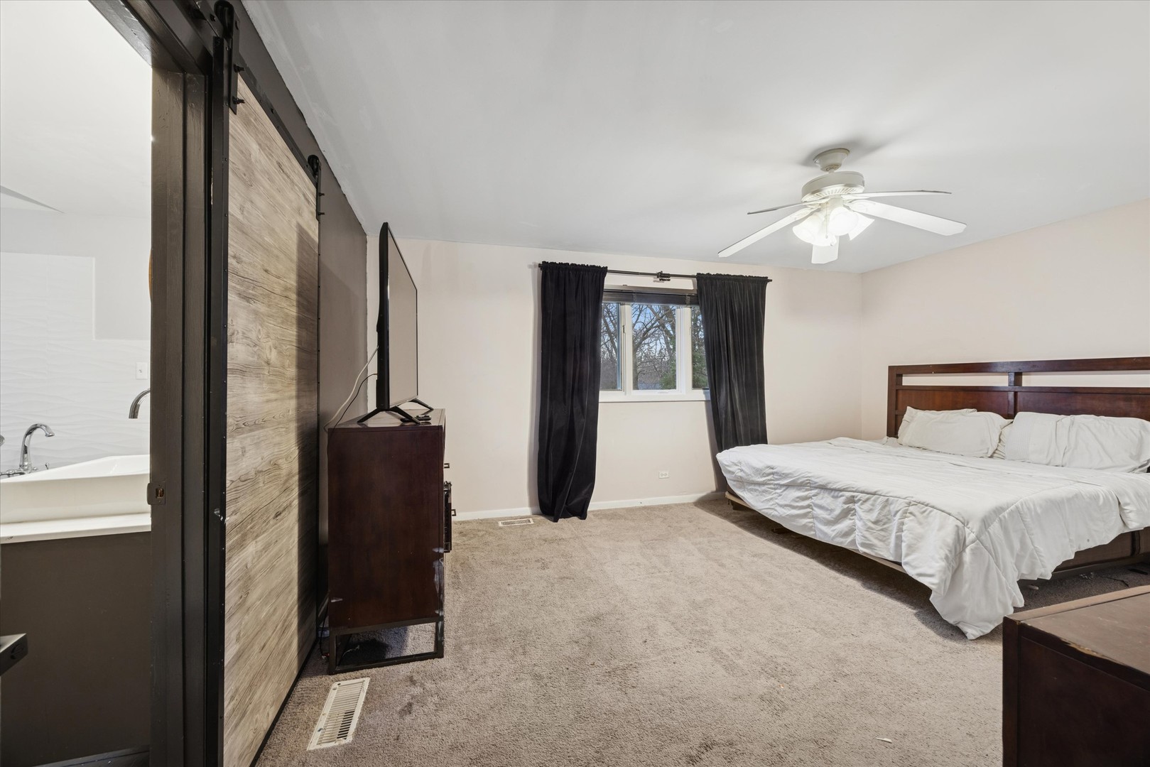 365 61st Street Willowbrook, IL 60527 - Photo 7 of 18 a bedroom with bed and a chandelier