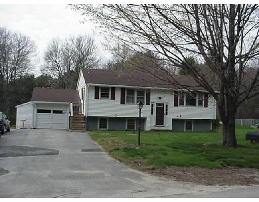 392 Cedar Street Hanover, MA 02339 - Photo 1 of 1 a front view of a house with a yard and trees