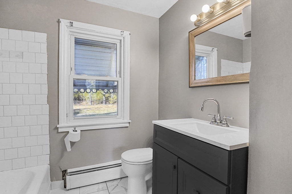 74 Valley Road Springfield, MA 01119 - Photo 14 of 23 a bathroom with a sink vanity and toilet