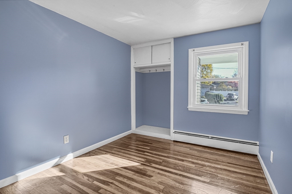 74 Valley Road Springfield, MA 01119 - Photo 15 of 23 a view of an empty room with window and wooden floor