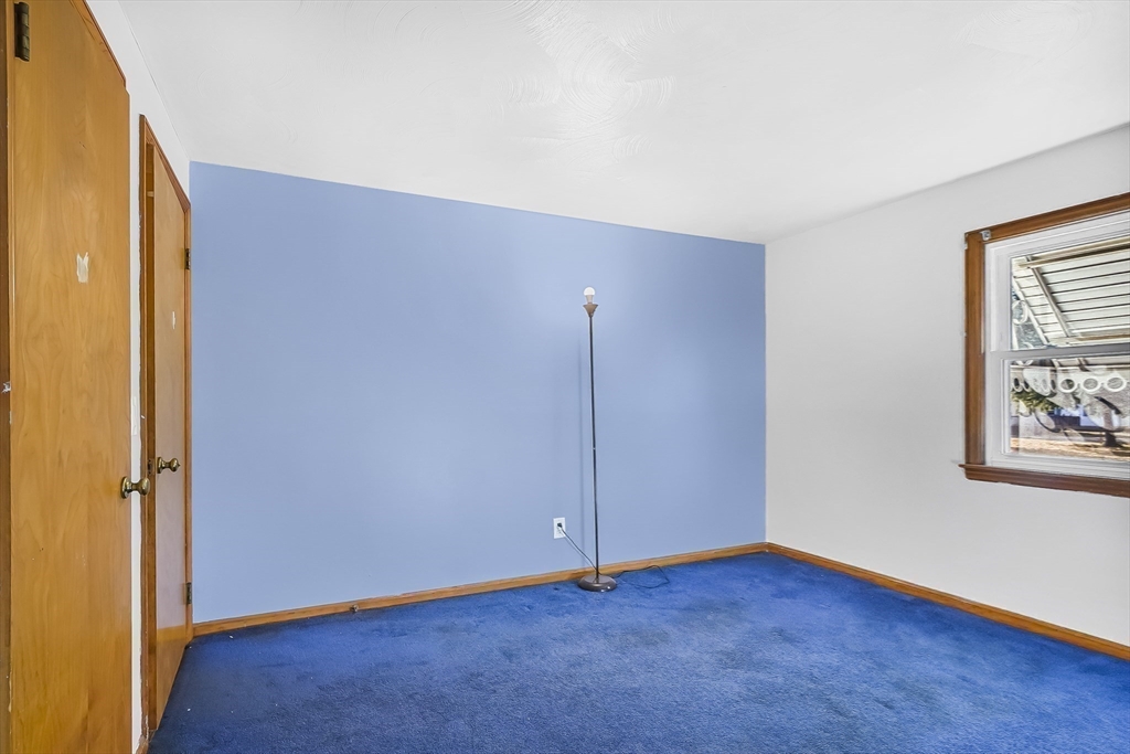 74 Valley Road Springfield, MA 01119 - Photo 19 of 23 an empty room with wooden floor and windows