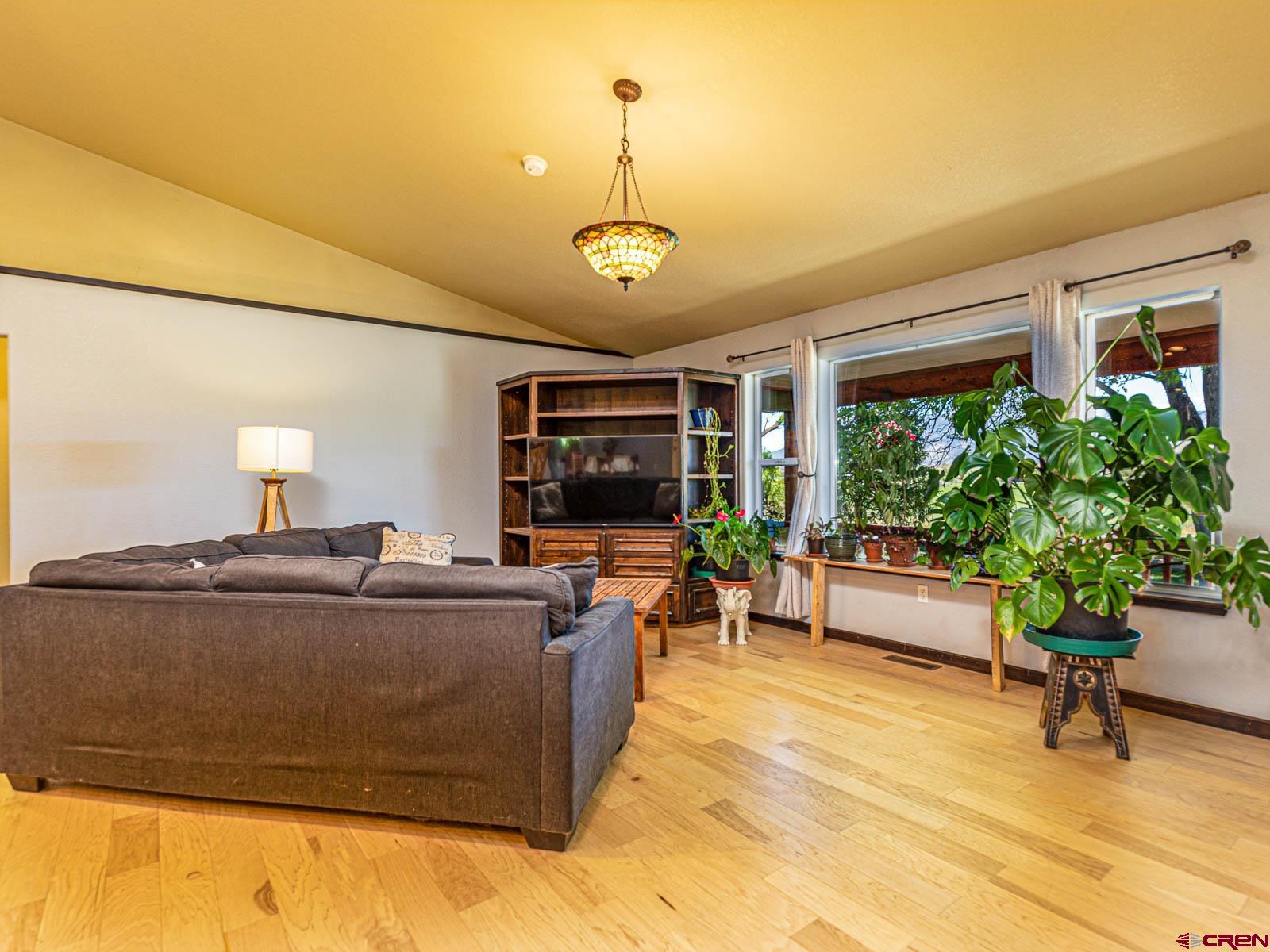 5085 3675th Road Crawford, CO 81415 - Photo 12 of 35 a living room with furniture and a large window