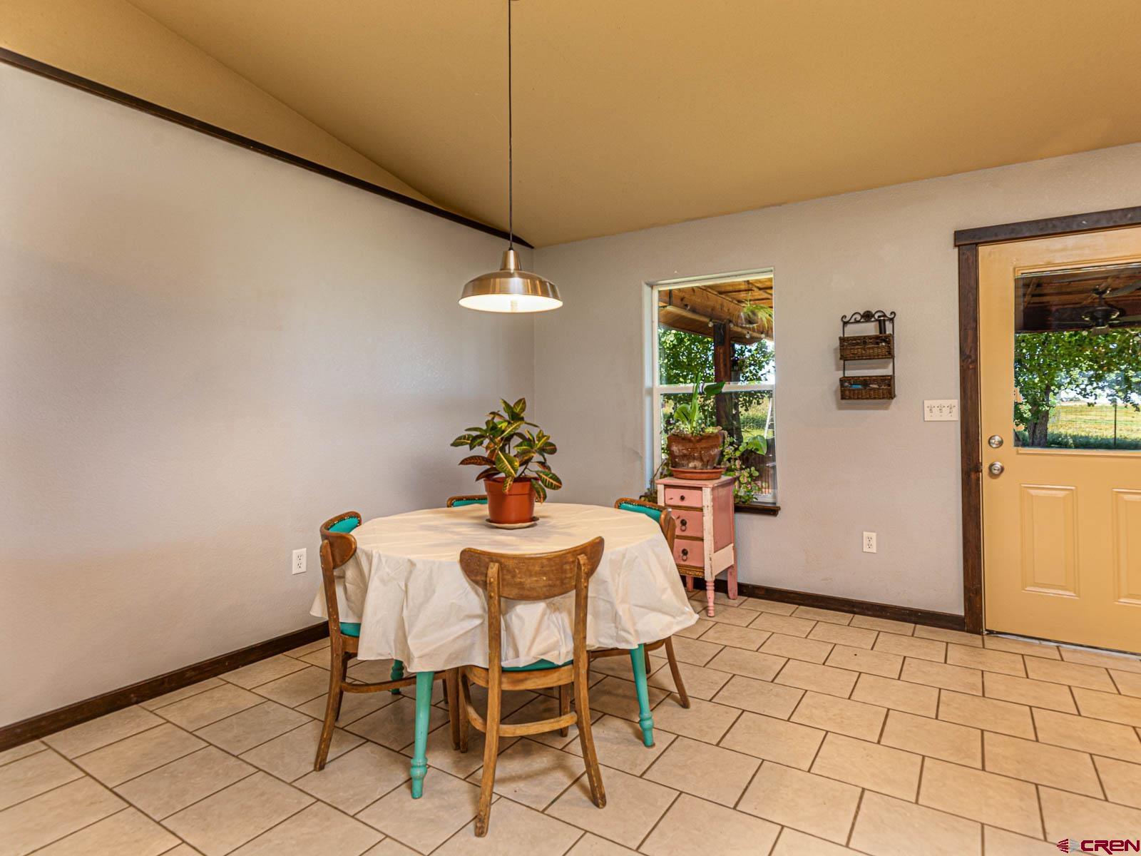 5085 3675th Road Crawford, CO 81415 - Photo 13 of 35 a view of a dining room with furniture and window