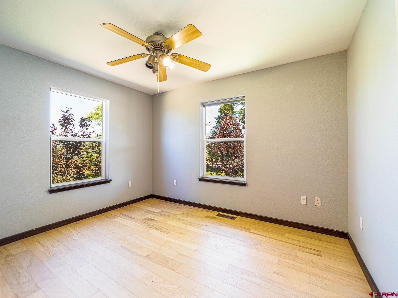 5085 3675th Road Crawford, CO 81415 - Photo 15 of 35 an empty room with window and ceiling fan
