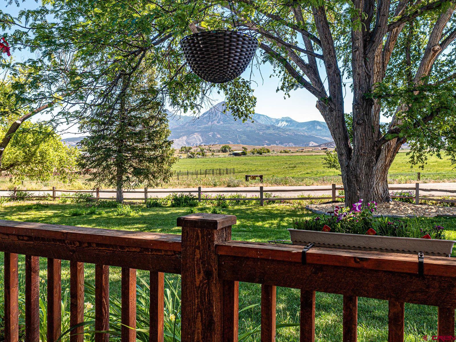 5085 3675th Road Crawford, CO 81415 - Photo 2 of 35 a view of a wooden deck with a lake view
